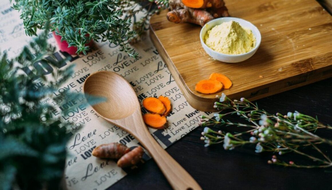 wooden ladle and chopping board with ginger during daytime