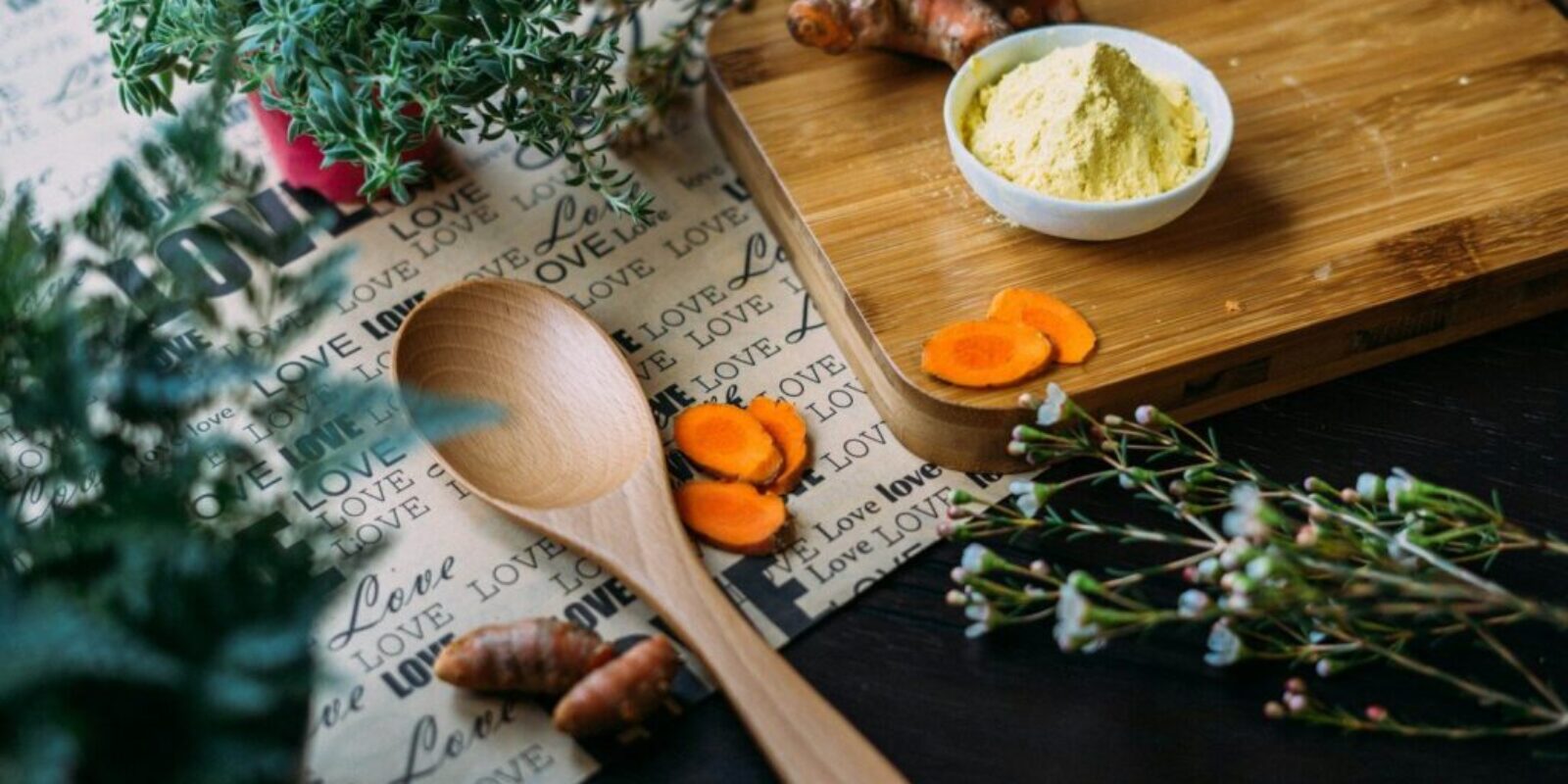 wooden ladle and chopping board with ginger during daytime